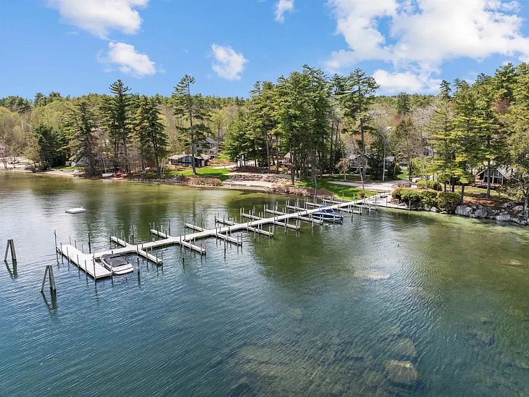 Aerial view of Lake Winnipesaukee shoreline and docks near The Brookhurst Lake House in Meredith, New Hampshire